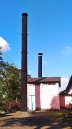 Low angle view of built structure against blue sky