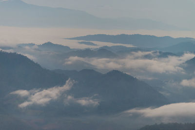 Scenic view of cloudscape and mountains against sky