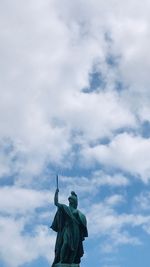 Low angle view of statue against cloudy sky