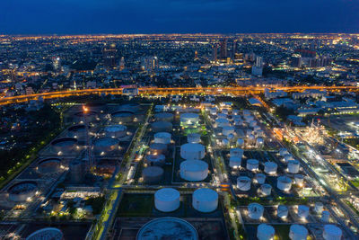 High angle view of illuminated city buildings at night