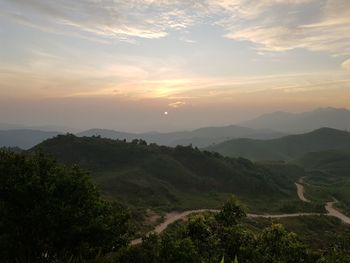 Scenic view of landscape against sky during sunset