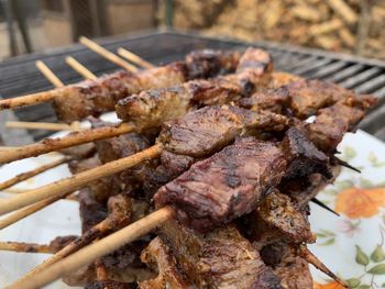 Close-up of meat on barbecue grill