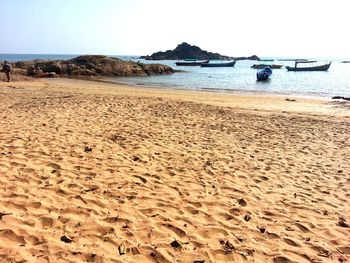 Scenic view of beach against clear sky