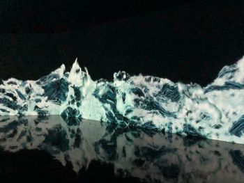 Digital composite image of a horse in the dark