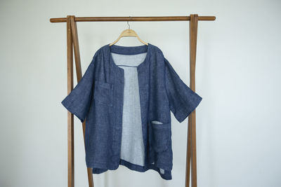 Woman blouse with dry indigo blue on white background.