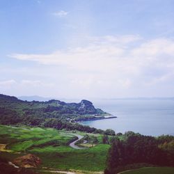 Scenic view of sea against cloudy sky