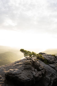 Rock formations on landscape against sky