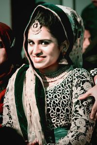 Portrait of smiling bride wearing traditional clothing