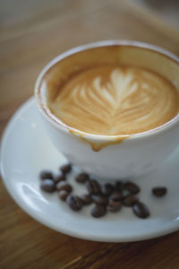 Close-up of cappuccino on table