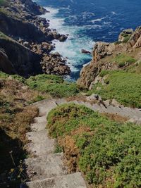 High angle view of rocks on sea shore