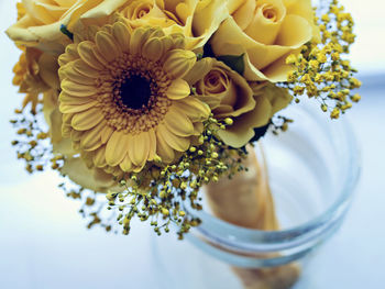 Close-up of bouquet in vase on table at home