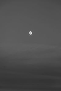 Low angle view of moon against sky at night