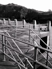 Close-up of railing against clear sky