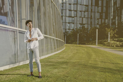 Young man standing on wall