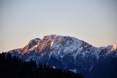 Scenic view of snowcapped mountains against clear sky