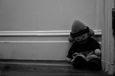 Boy looking away while sitting on floor