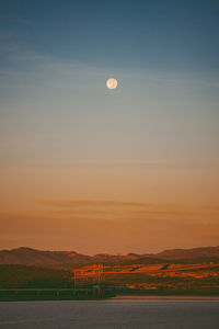 Scenic view of landscape against sky at sunset