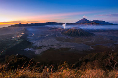 View of volcanic landscape against sky during sunset