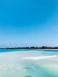 Scenic view of sea against blue sky