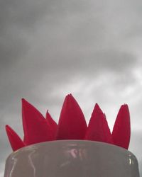 Close up of red fabric against sky