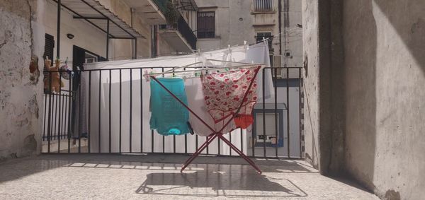 Clothes drying on wall in building