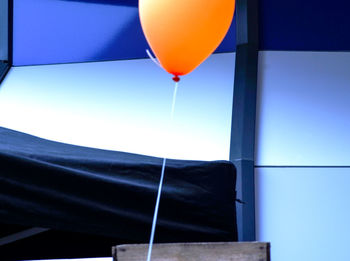 Low angle view of balloons against sky