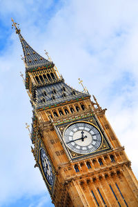 Low angle view of big ben against cloudy sky