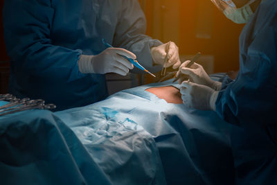 Surgeons doing surgery in operating room