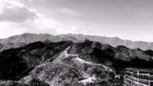 View of mountain range against cloudy sky