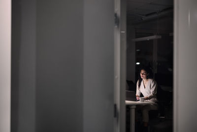 Woman working late in office