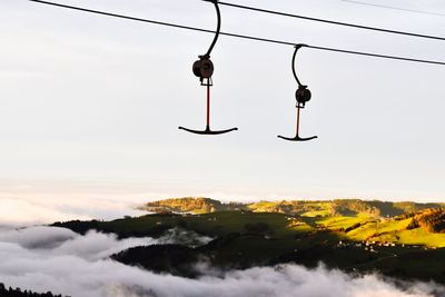 Low angle view of cable against sky