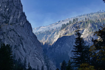 Low angle view of mountain against blue sky