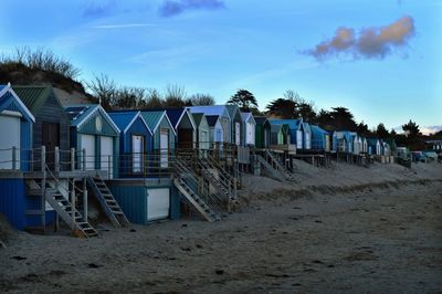 Beach huts against sky