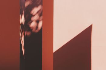 Shadow on red wall