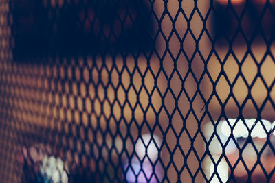 Full frame shot of chainlink fence during sunset