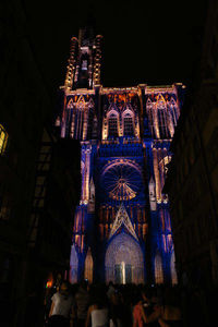 Low angle view of illuminated building at night