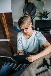 Woman artist drawing sketch. female artist creates a sketch.