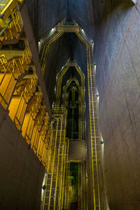 Low angle view of illuminated building at night