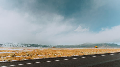 Empty road against sky