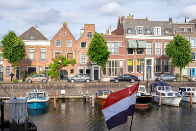 Boats moored at harbor