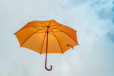 Low angle view of umbrella against sky