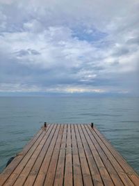 Pier over sea against sky