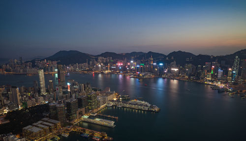 Aerial view of city lit up at night