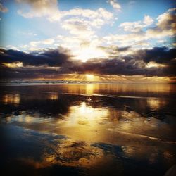 Scenic view of lake against sky during sunset