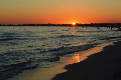 Scenic view of beach against sky during sunset