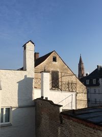 Low angle view of building against blue sky