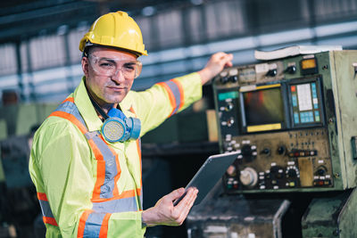 Portrait of man working with mobile phone