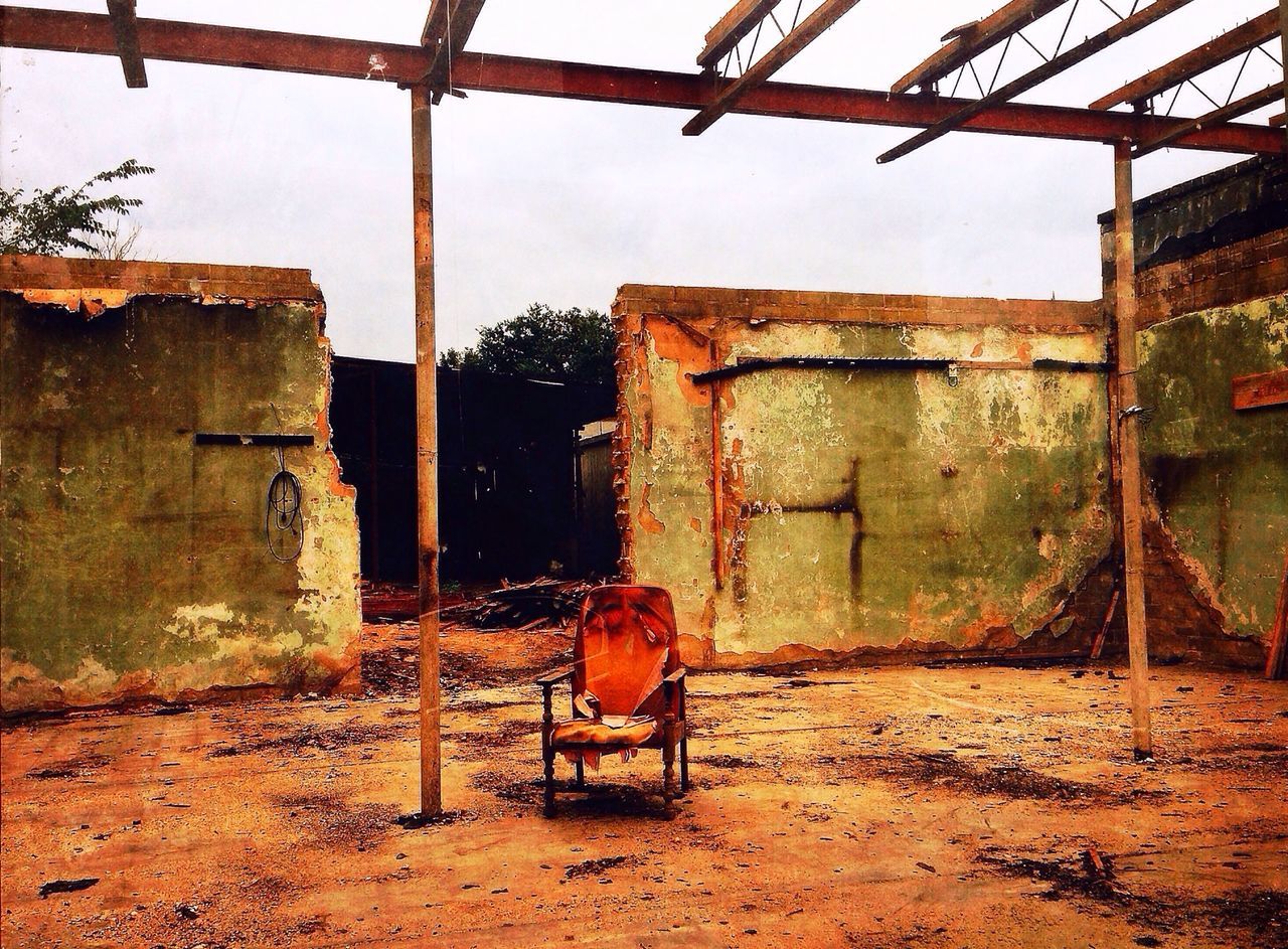 architecture, built structure, abandoned, obsolete, building exterior, damaged, deterioration, run-down, animal themes, house, old, one animal, bad condition, full length, domestic animals, weathered, sunlight, outdoors, day, mammal