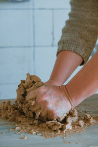 Close-up of person preparing food on table