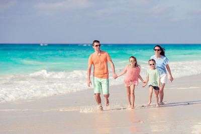 Full length of man on beach against sky